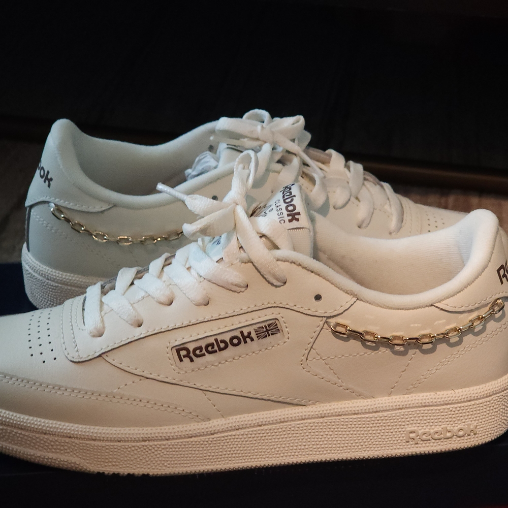 Reebok White Sneakers with Gold Chain Accent